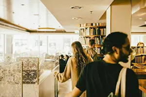 Stay Prints: Rear view of people walking with luggage in hotel lobby