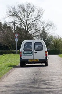 Vans Prints: Rear view of a wildlife ambulance travelling along a road in England