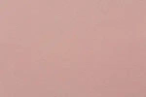 Recycled craft paper textured background in light pink old rose color