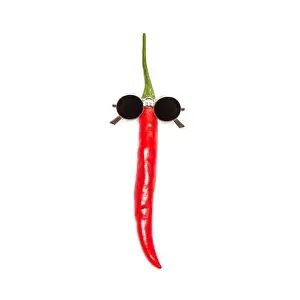 Chilli Prints: Red chili pepper in sunglasses isolated on white background