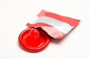 Rubber Prints: Red condom with wrapper