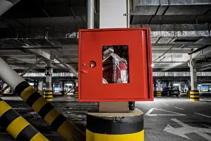 Reel Prints: Red fire crane at underground parking with illuminated background