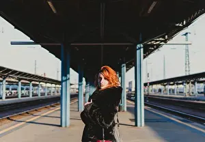 Curly Hair Prints: red-haired woman in train station