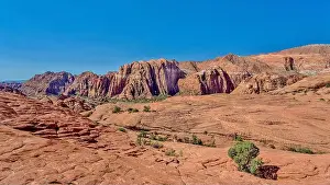 Rising Prints: The Red Mountains rising behind the petrified sand dunes at Snow Canyon State Park