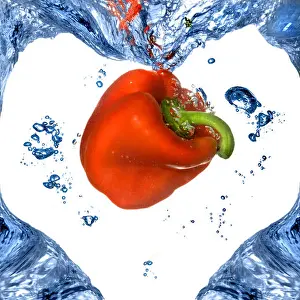 Wet White Prints: Red pepper with shape of heart from blue water isolated on white