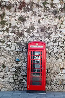 Booth Prints: Red Phone Booth on Stone Wall in Gibraltar