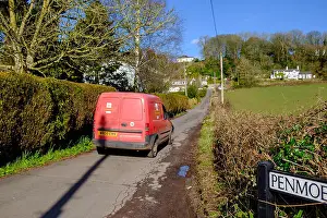 Rural Area Prints: Red Royal Mail post van in country lane delivering post/mail in rural area