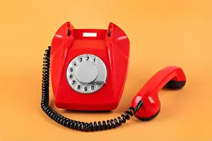 Handset Prints: One red telephone with handset on pale orange background