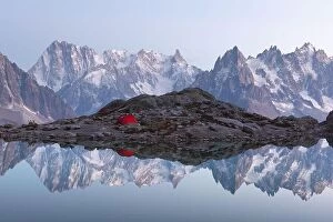 Images Dated 16th October 2018: Red tent on Lac Blanc lake coast in France Alps. Monte Bianco mountains range on background