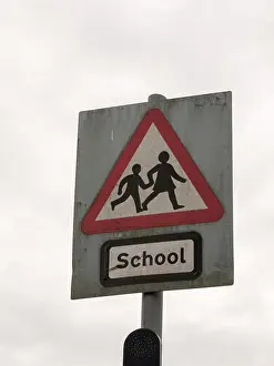 Informative Prints: a red white and black school crossing sign with a cloudy sky background danger careful cars motor accidents careful