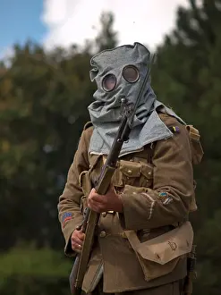 Injury Prints: During a reenactment of a First World War battle a participant wears a period gas-mask