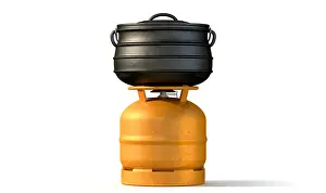 Stove Prints: A regular metal orange gas bottle with a burner attachment with a black south african potjie pot rest on it