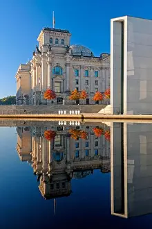 Morning Sky Prints: Reichstag and Paul-Loebe-Haus reflected in the Spree at sunrise, Berlin, Germany