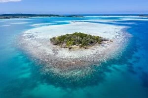 Images Dated 24th January 2020: A remote, tropical island in the Molucca Sea, Indonesia, is surrounded by a healthy coral reef