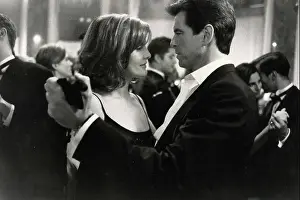 Renè Russo and Pierce Brosnan in the movie The Thomas Crown Affair, 1999