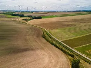 Wind Farm Prints: Renewable Energy Wind Farm in Agriculture Fields in Countryside Drone Aerial View