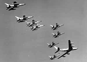 Superiority Prints: Republic F-105 Thunderchiefs receive in-flight refueling from a Boeing KC-135 Stratotanker during a mission to North
