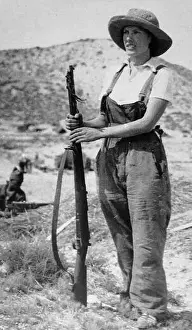 Civilian Prints: Republican woman civilian stands guard with a rifle during the Spanish Civil War
