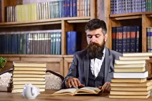 Concentrated Prints: Research and studying concept. Man in classic suit