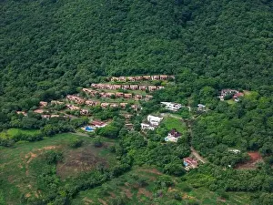 Green Park Prints: Residential with pool in green hill background aerial drone view
