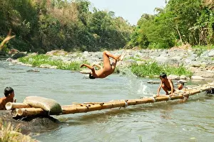 East Java Prints: Residents in Taman Krocok village, Bondowoso, use the river for bathing and for playing