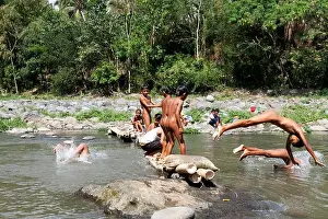 East Java Prints: Residents in Taman Krocok village, Bondowoso, use the river for bathing and for playing