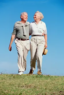 Room For Copy Prints: Retired couple walking outdoors