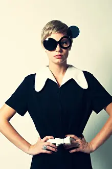 Pensive Prints: A retro woman posing in a mod 60s dress