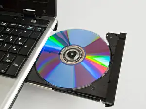 Computers Prints: A rewritable CD ROM in the CD drive of a labtop computer
