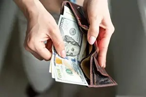 Purse Prints: Rich woman taking from purse money