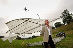 Exhilarating Prints: Richard Branson next to a replica of Sir George Cayley's glider