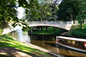 Riga Prints: Riga City Canal bridge and boat in summer day. Riga, Latvia