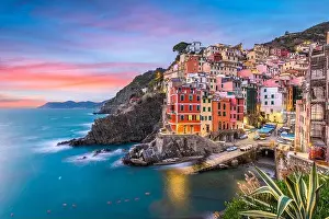 Riomaggiore, Italy at dusk. Riomaggiore is one of the five towns of Cinque Terre