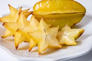 Crisp Prints: Ripe fresh exotic averrhoa carambola or star fruits on board