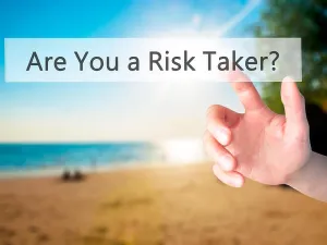 Plan Prints: Are You a Risk Taker ? - Hand pressing a button on blurred background concept