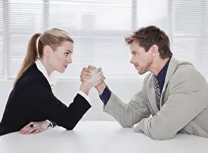 Face To Face Prints: Rival business people arm wrestling