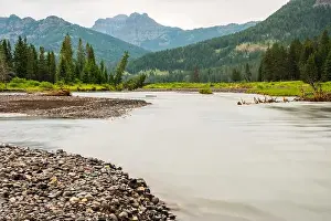 Outdoorsy Prints: River flowing through a forest and mountain valley in Yellowstone