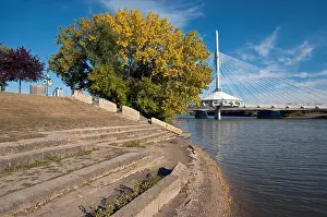 Riverwalk Prints: Riverbank along the Red River at The Forks (in the background the Esplanade Riel Pedestrian Bridge)