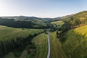 Road going through forests and villages of the Liptov region in Slovakia