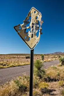 Vandalism Prints: Road sign riddled with bullet holes