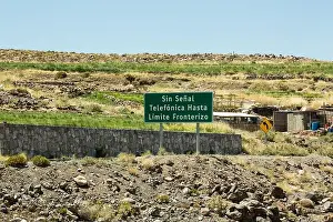 Altiplano Prints: A road sign in Spanish at high altitude in the Andes near the village of Socaire