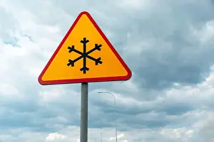 Slippery Prints: Road sign warning of road frosting, snowflake