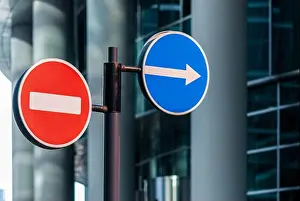 Halt Prints: road signs against modern glass building background