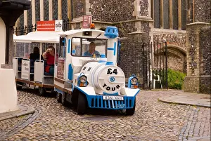 Guided Prints: Road train taking tourists down Elm Hill in Norwich, Norfolk, Uk