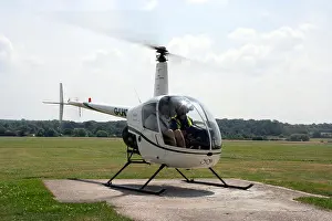 Aerodrome Prints: A Robinson R22 preparing to take off from Redhill Aerodrome