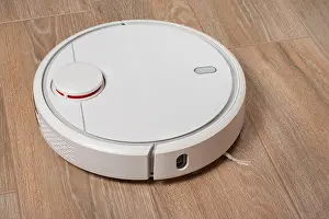 Cleanliness Prints: Robot vacuum cleaner cleaning dust on tile floors