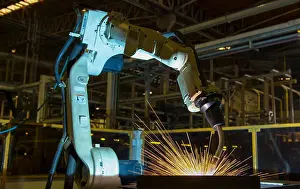 White Work Prints: Robot is welding part in automotive factory