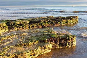North Sea Coast Prints: Rocks protrude out into the North Sea on Roker Beach near Sunderland in Tyne and Wear