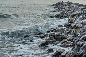 Rocks and sea : View of sea waves hitting rocks on the Calm beach in the morning. No focus, specifically