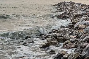 Rocks and sea : View of sea waves hitting rocks on the Calm beach in the morning. No focus, specifically